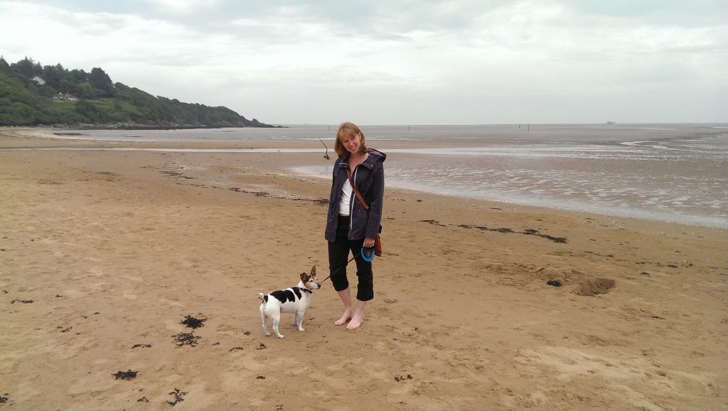 Sarah and dog on the beach in Dumfries & Galloway